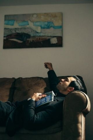 Pensive man on a couch