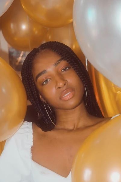 Black woman with balloon background