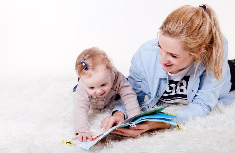 A baby and mom reading