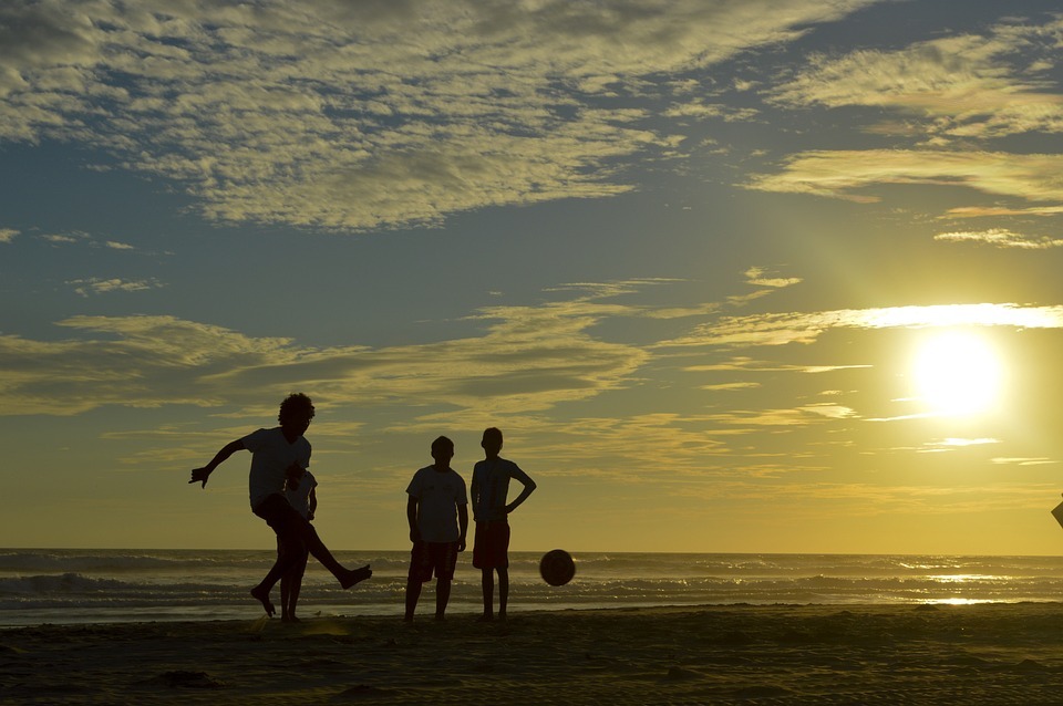 Soccer-beach-kids-ball-sunset