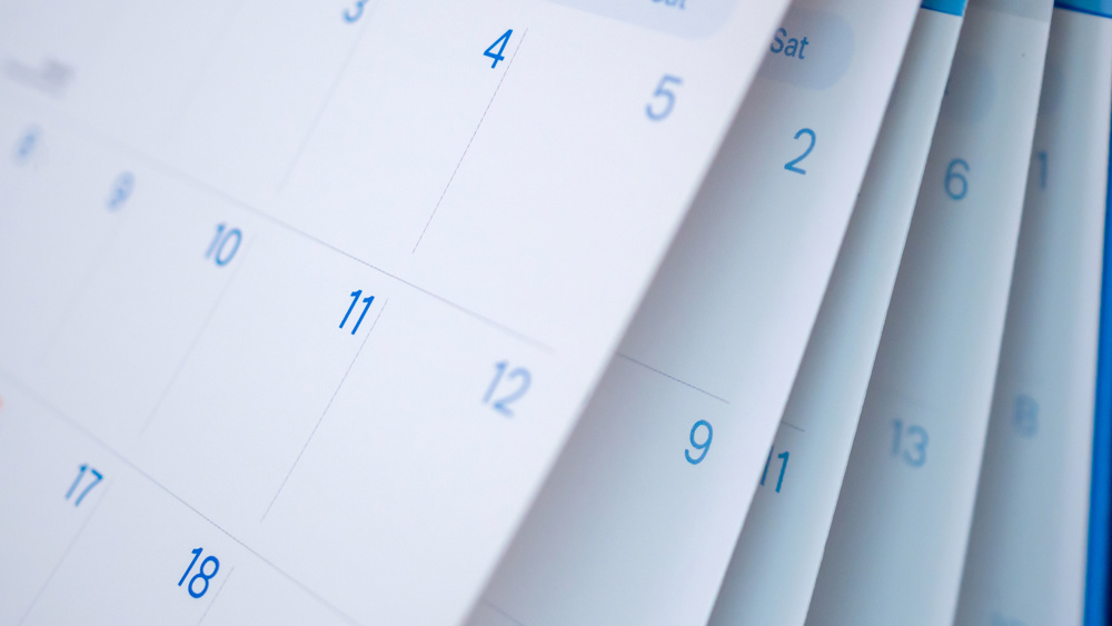 Abstract blur calendar page flipping sheet close up background business schedule planning appointment meeting concept